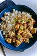 sesame chicken plated with rice